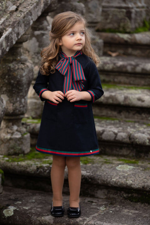 Navy blue dress with a large striped bow