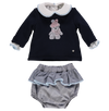 Set of blue knit sweater with plaid shorts and pompoms