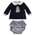 Set of blue knit sweater with plaid shorts and pompoms