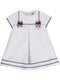 Loose white dress with sailor details