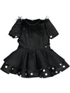 Black dress with feather detail and polka dot fabric