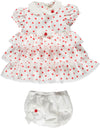 White dress with red polka dots with shorts and bow