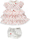White dress with red polka dots with shorts and bow