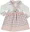 Conjunto de blusa branca com saia xadrêz rosa com alças e laços na frente