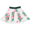 White flowing skirt with flower pattern and green belt