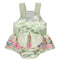 Green strappy bodysuit with colorful pattern, ruffles and bow