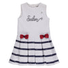 White dress with navy blue stripes and red bows