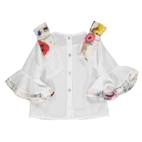 Flowing white blouse with ruffles and floral-patterned bows
