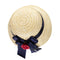 Straw hat with navy ribbon and red flower