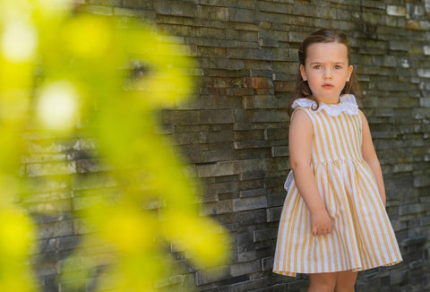 Yellow dress with stripes and bow